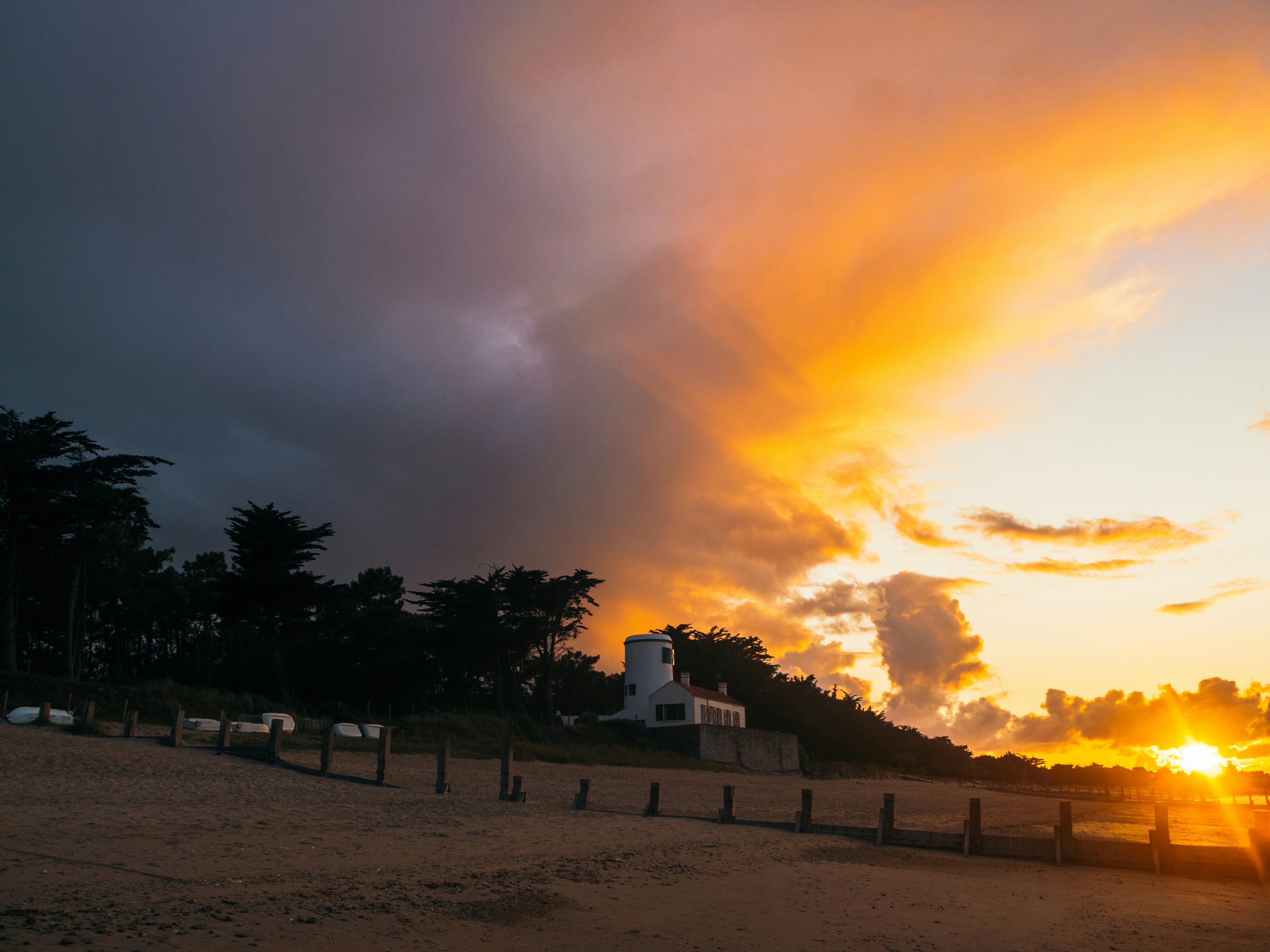 A bright sunset over farm land.