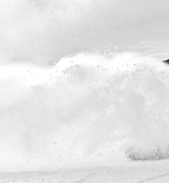 grayscale photography of person skiing