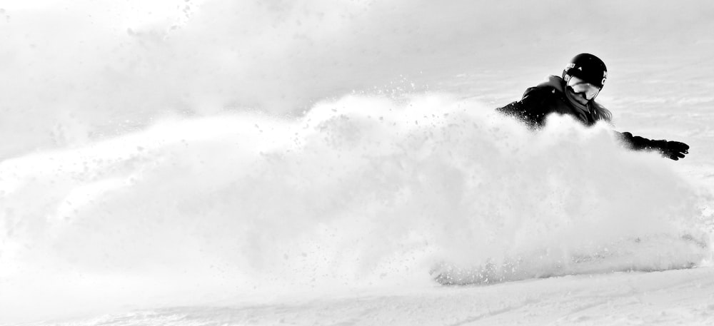 grayscale photography of person skiing