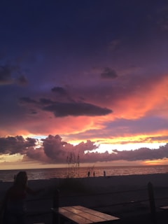 A vibrant sunset captured on a beach.