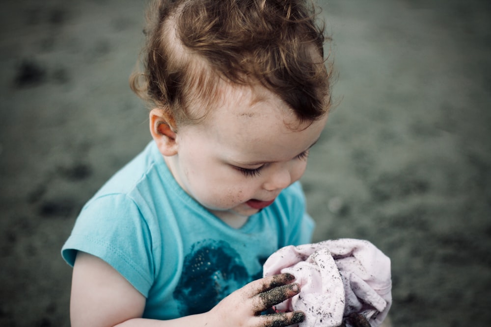 baby holding a cloth