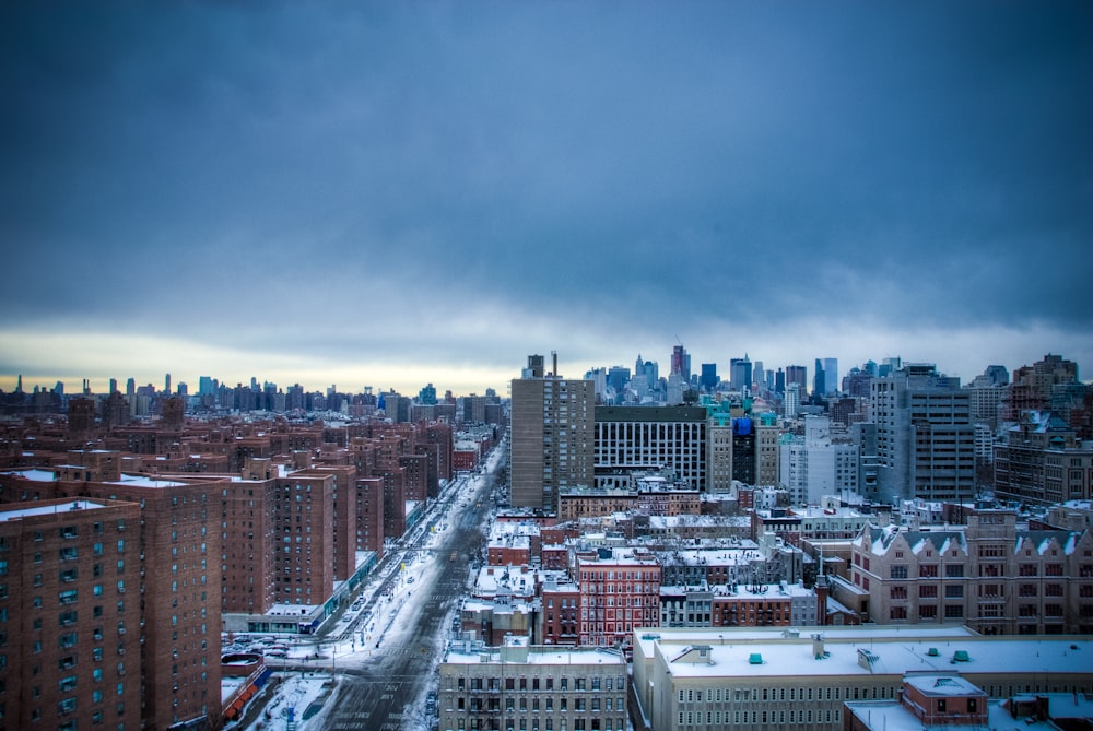 city skyline under cloudy sky