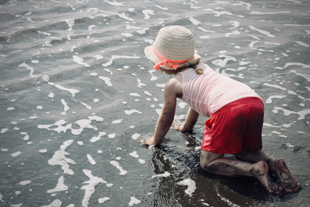 girl crawling at the seashore