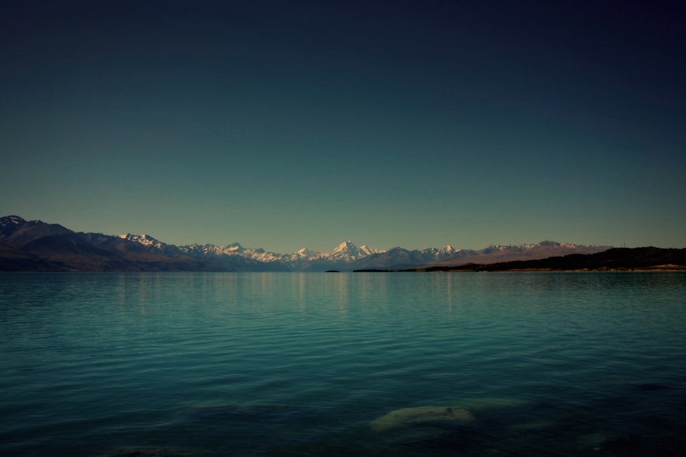 body of water under clear blue sky during daytime