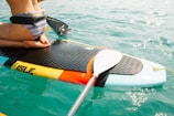 man riding paddle board