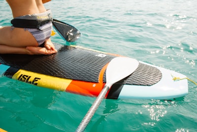 man riding paddle board