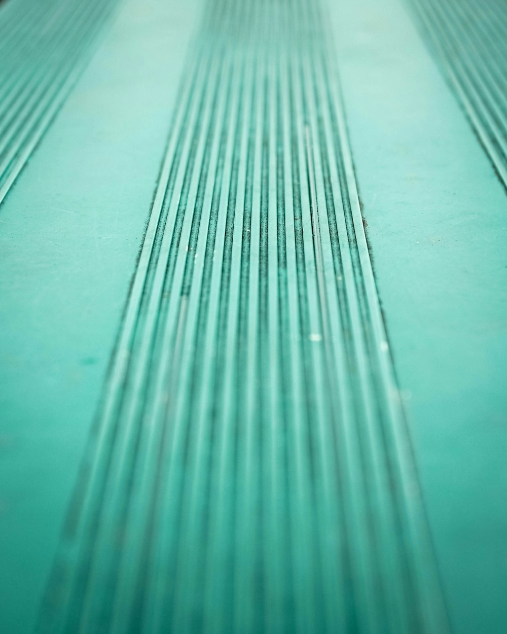 A bluish green line texture pattern.