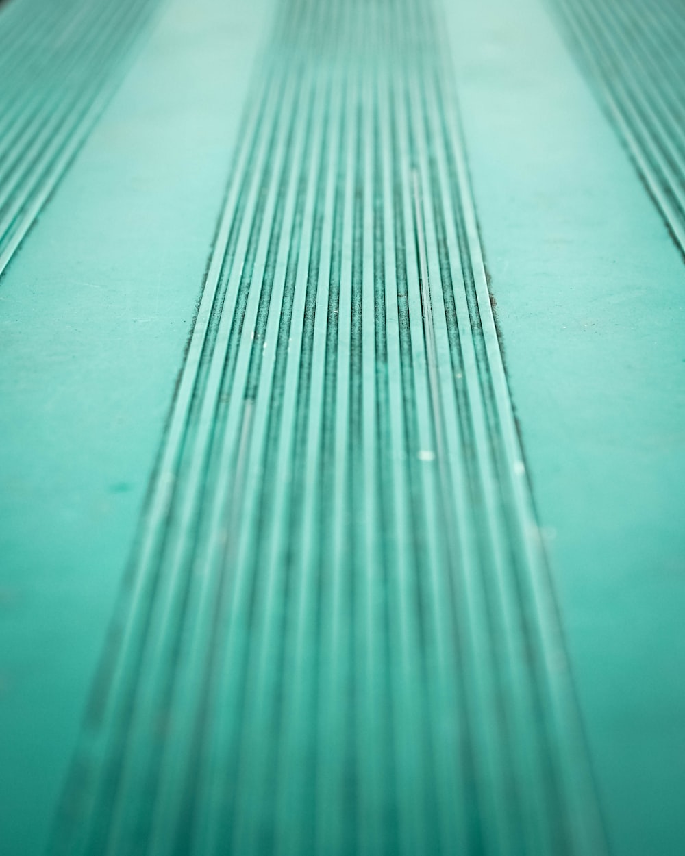 A bluish green line texture pattern.