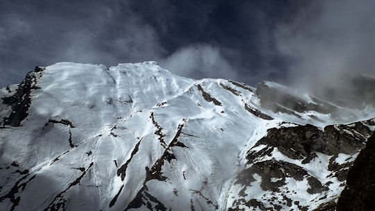 snow cover mountain during white cloudy sky in Mount Aspiring National Park New Zealand