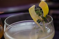 Close-up of a beautifully garnished cocktail with fresh fruit.