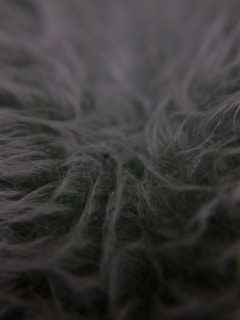 A close-up of a fiberglass material sample with a smooth texture.