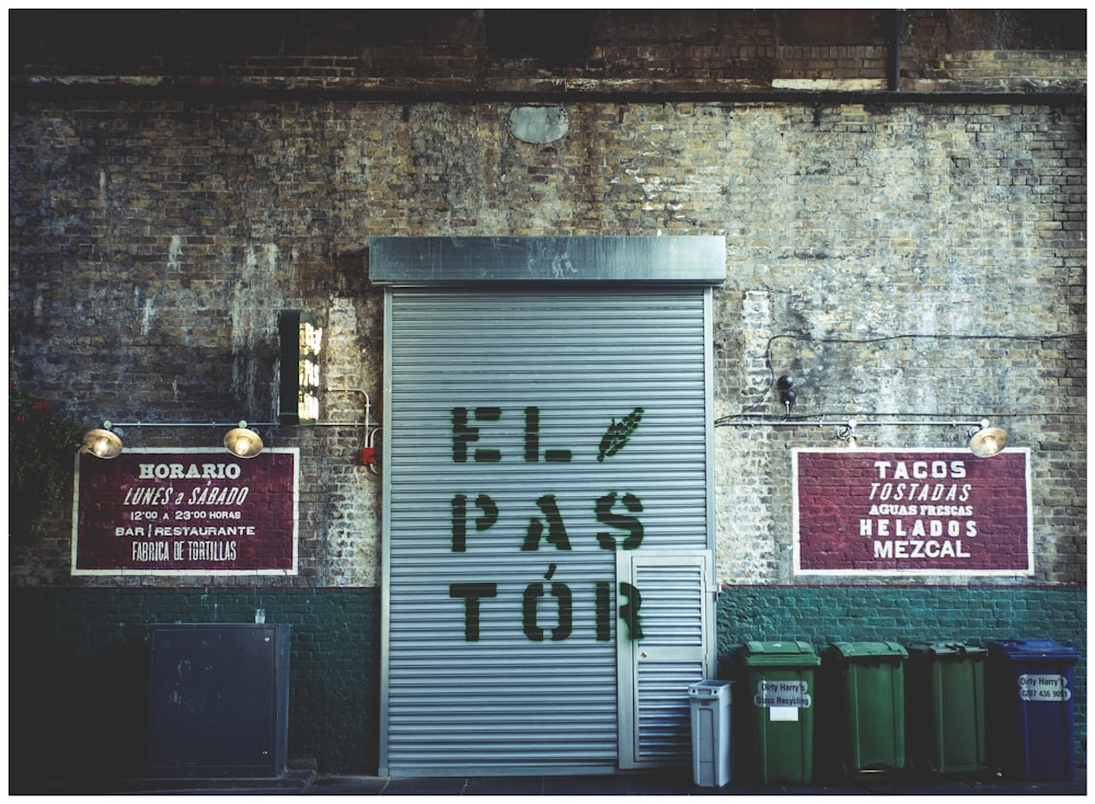 silver steel roller shutter with ElPASTOR signage