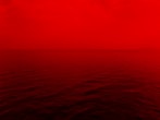 photo of ocean with red lights