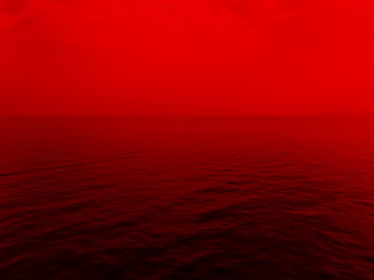 photo of ocean with red lights in Corfu Greece