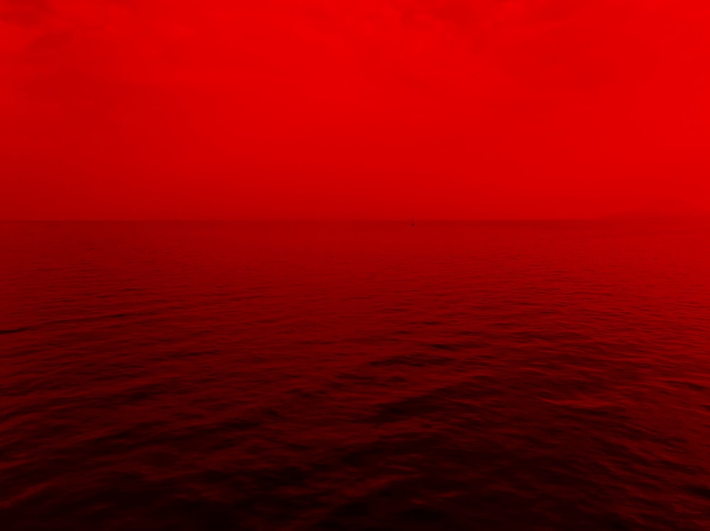 photo of ocean with red lights