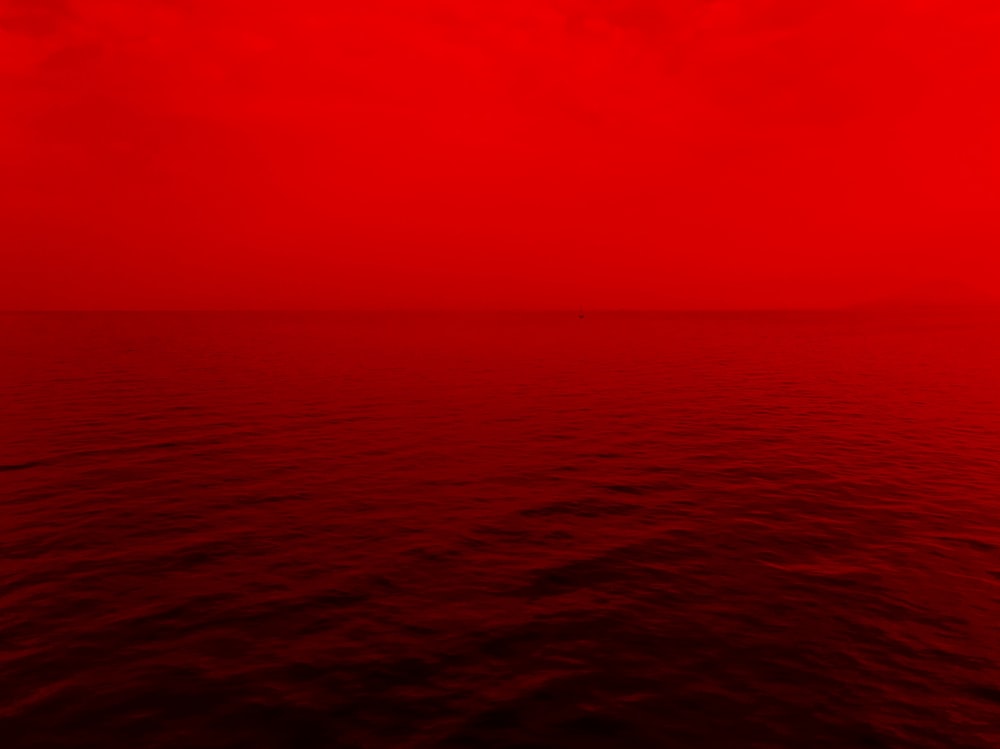 photo of ocean with red lights