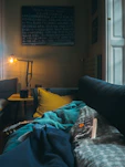 book on gray and white blanket