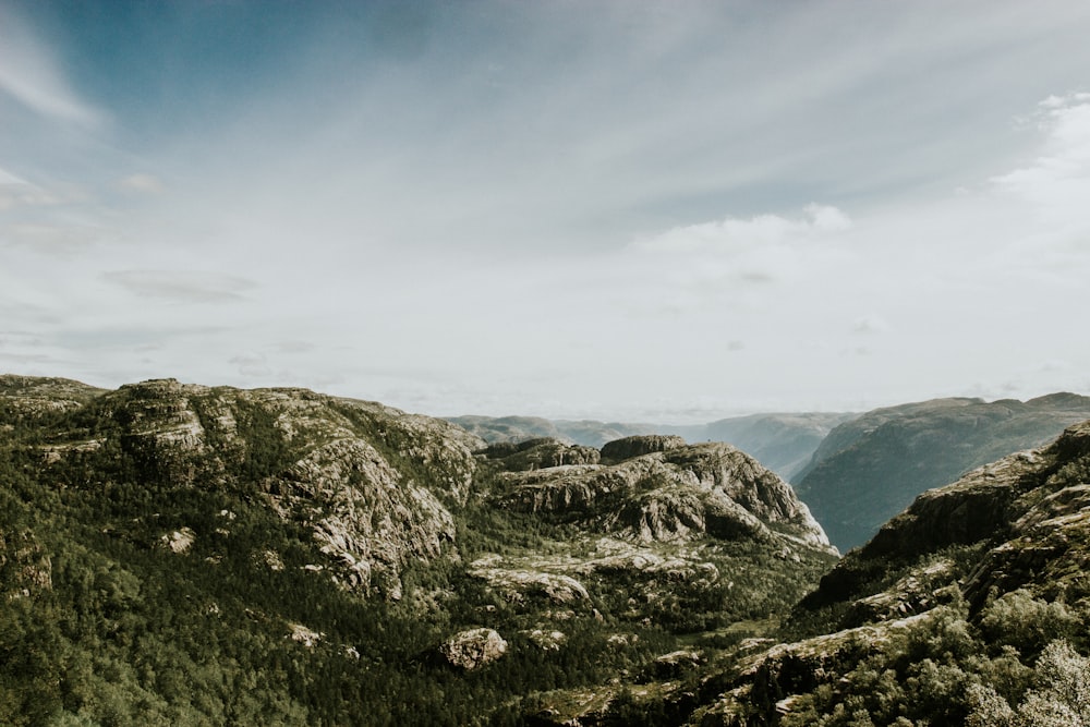 rock mountains under sky