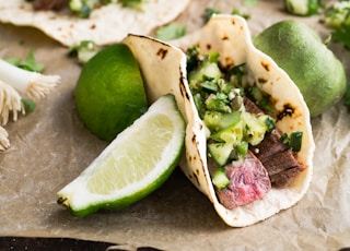 taco with beside sliced lemon