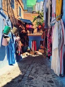 A bustling medina street filled with colorful spices, textiles, and locals sharing warm smiles.
