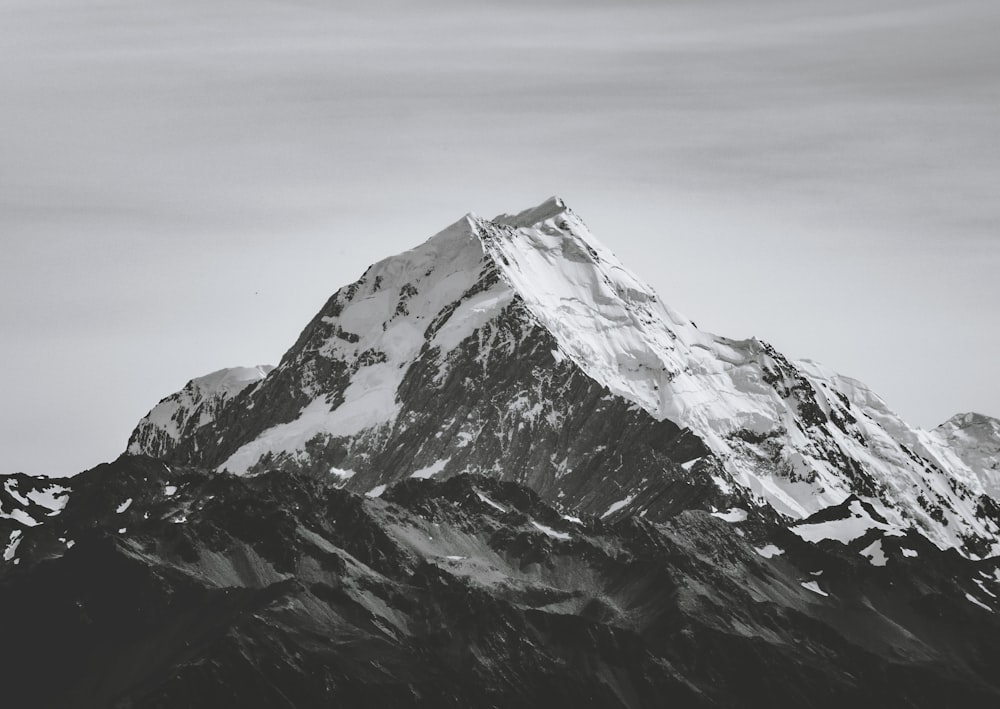 grayscale photography of snowcap mountain