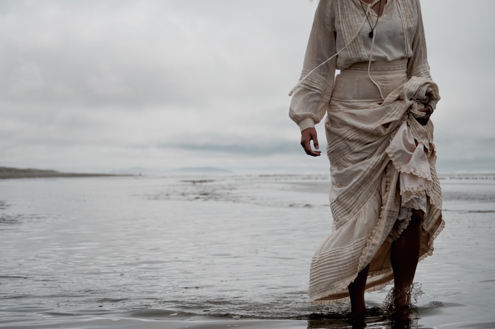 person standing on sea shore