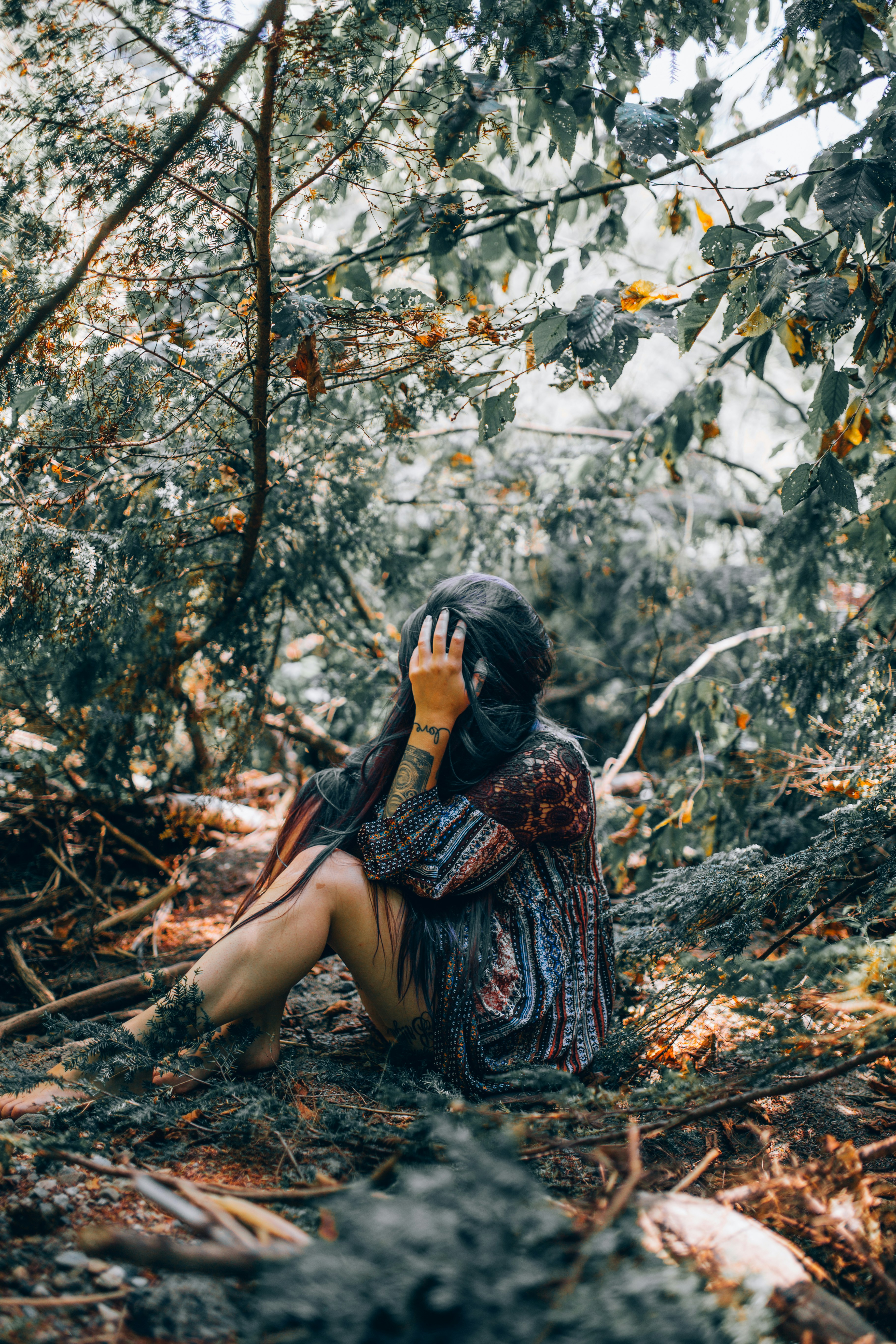 woman lying on dried grass nature photography