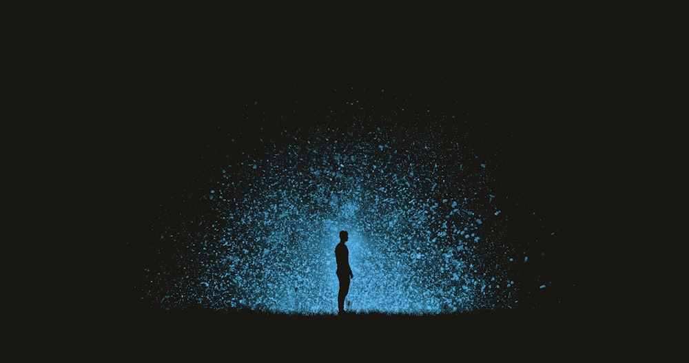 photo of man standing during nighttime