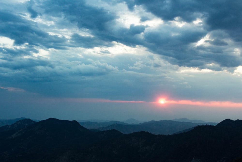 silhouette of mountains during sunset