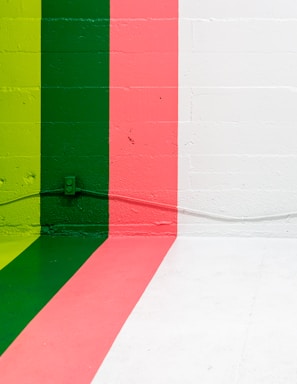 white, pink, green, and yellow painted wall