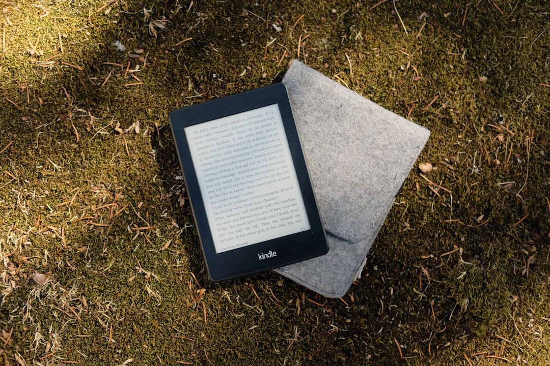 Kindle e-book reader on gray flip cover case