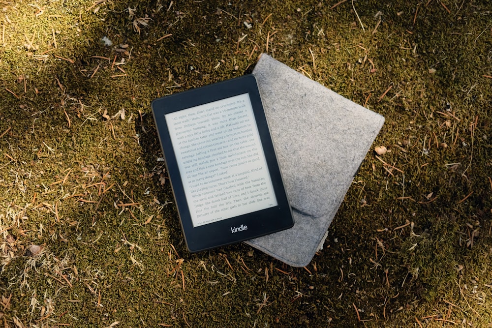 Kindle e-book reader on gray flip cover case