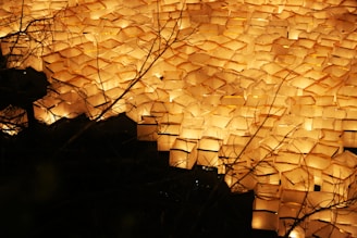 A serene evening scene with lanterns glowing softly in the conscious gallery space.