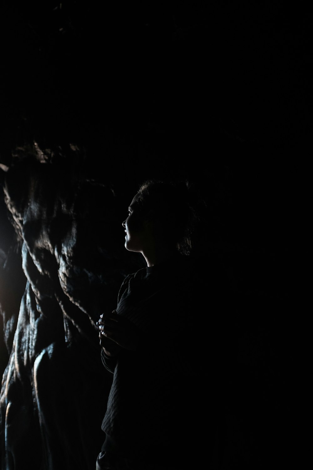 man and woman kissing in dark room