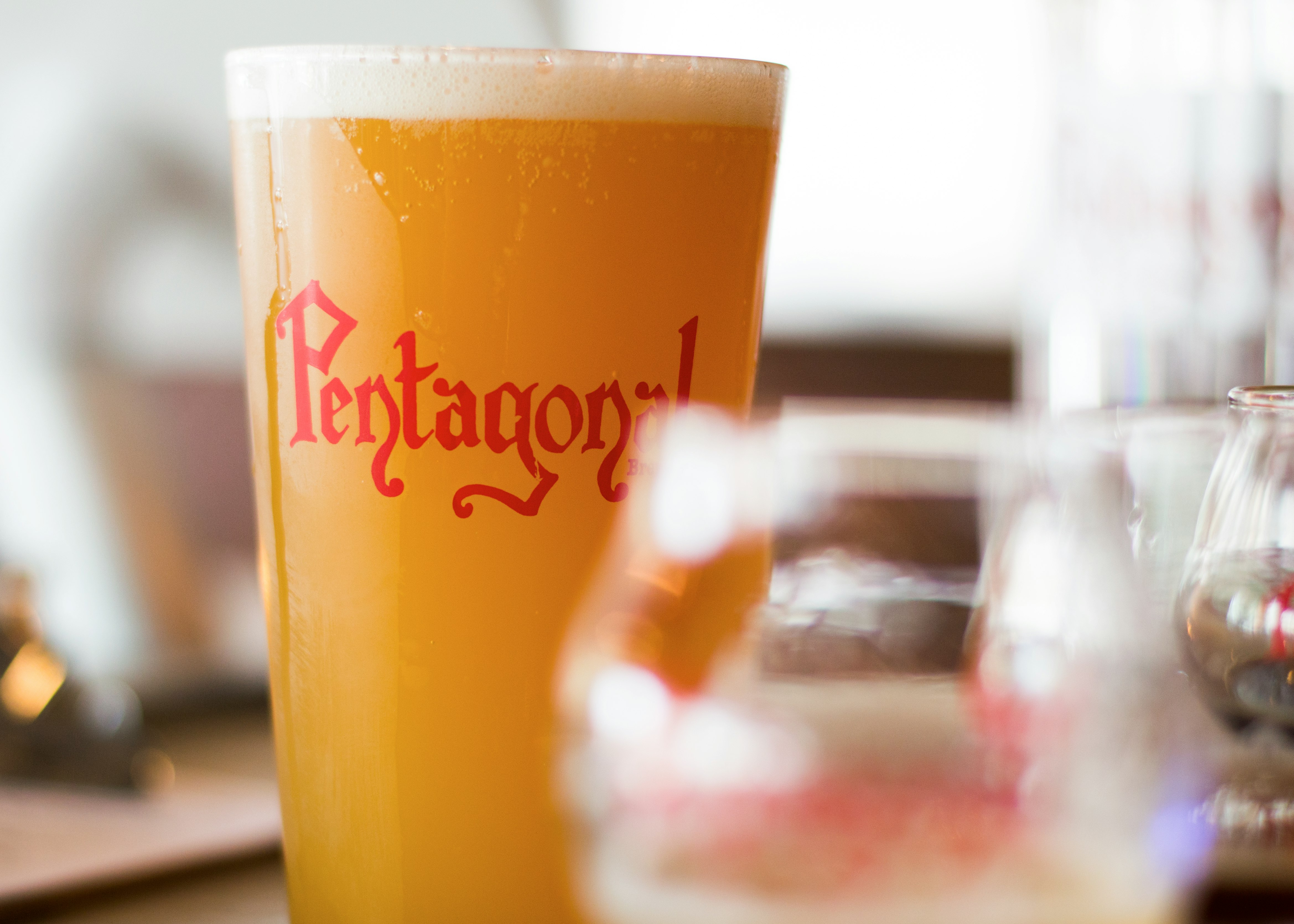 clear drinking glass filled with orange liquid