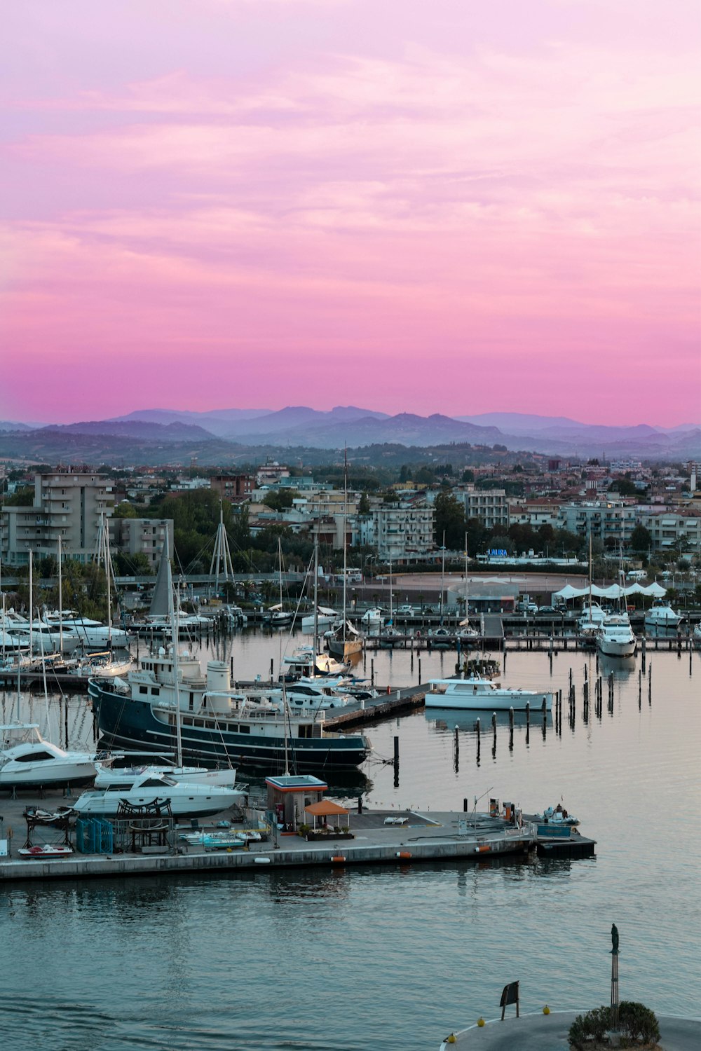 boats docked in marina during daytime