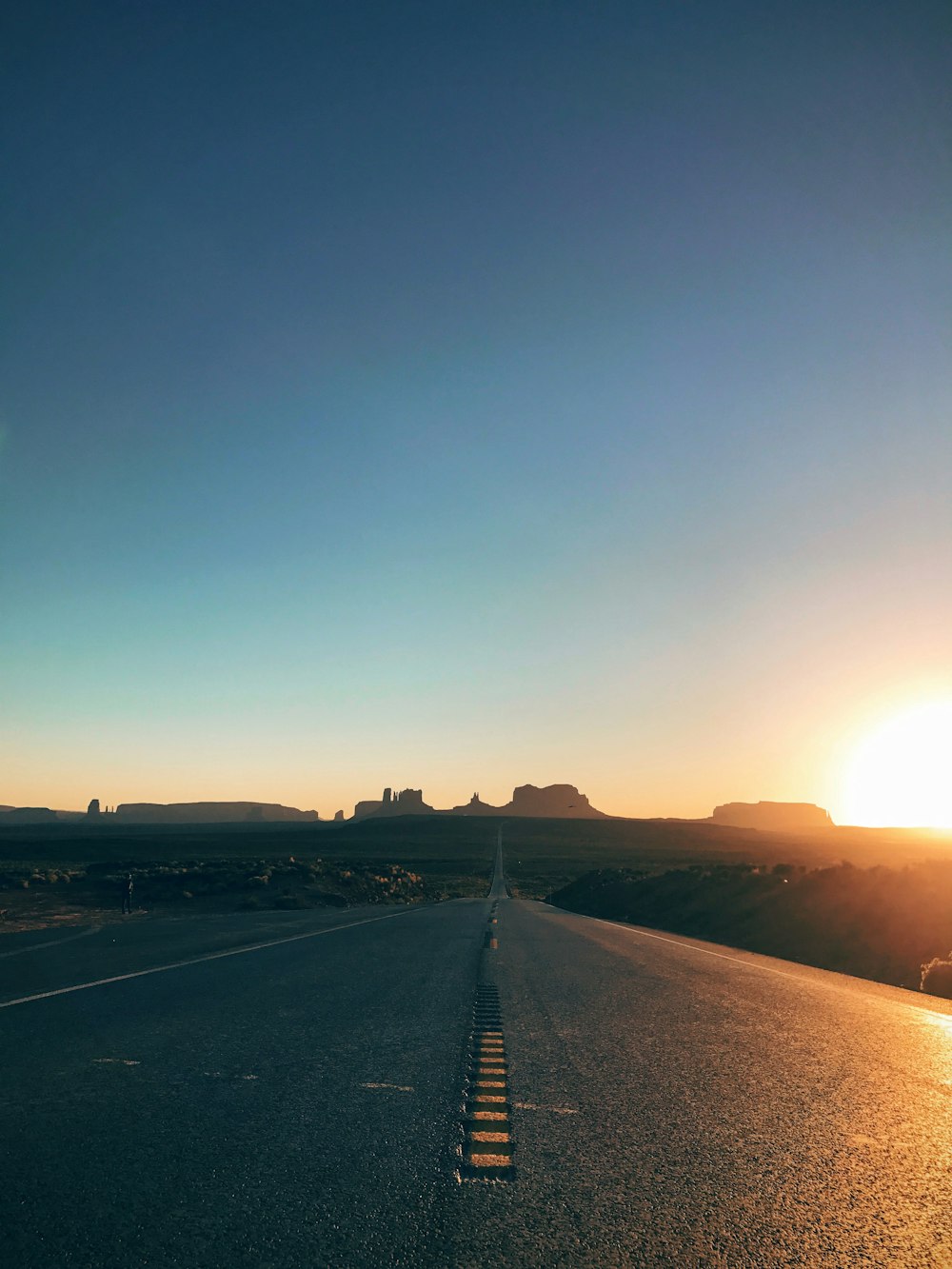 black asphalt road during sunset