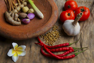 round brown clay bowl with vegetables