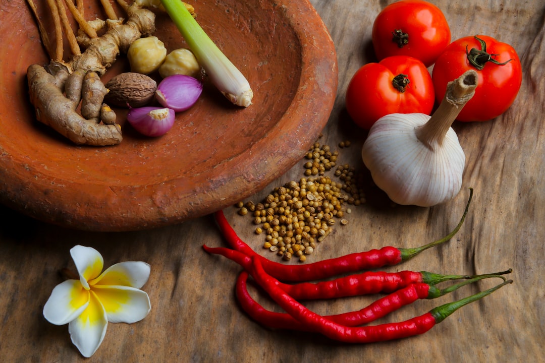 round brown clay bowl with vegetables