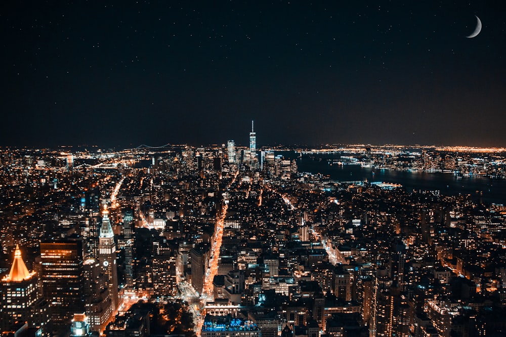 a view of a city at night from the top of a building