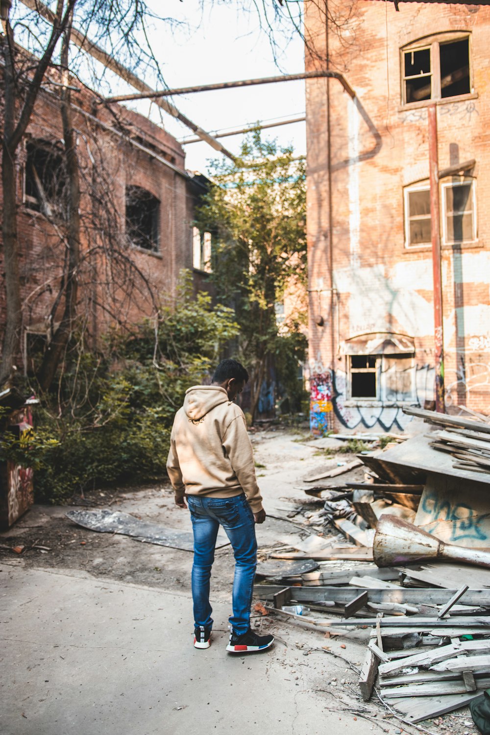 man standing nearby metal frames