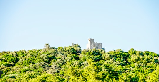 white concrete house under gray sky during daytime in Badija Croatia