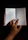 Close-up of hands flipping through a colorful vertellus notebook with a ballpen resting on top