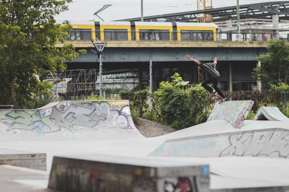 skater skating on skate park during daytime