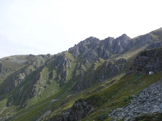 green and gray mountains under white sky during daytime in Verbier Switzerland