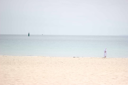 person standing on grass covered ground in Quiberon France