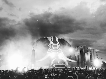 Crowd of metal fans enjoying an outdoor concert under misty mountain skies at Dieng Java Invasion.