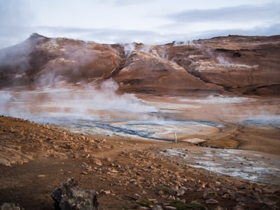 landscape photography of brown mountain hot spring zoom background