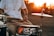 person playing drum during golden hour