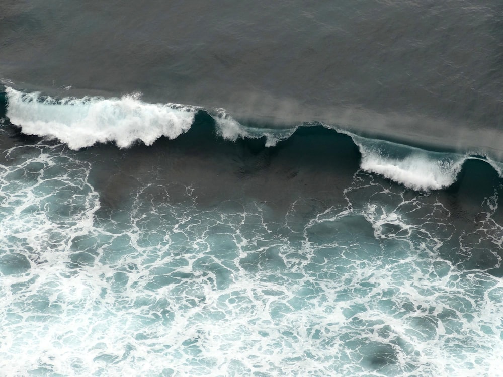 waves crashing on sand